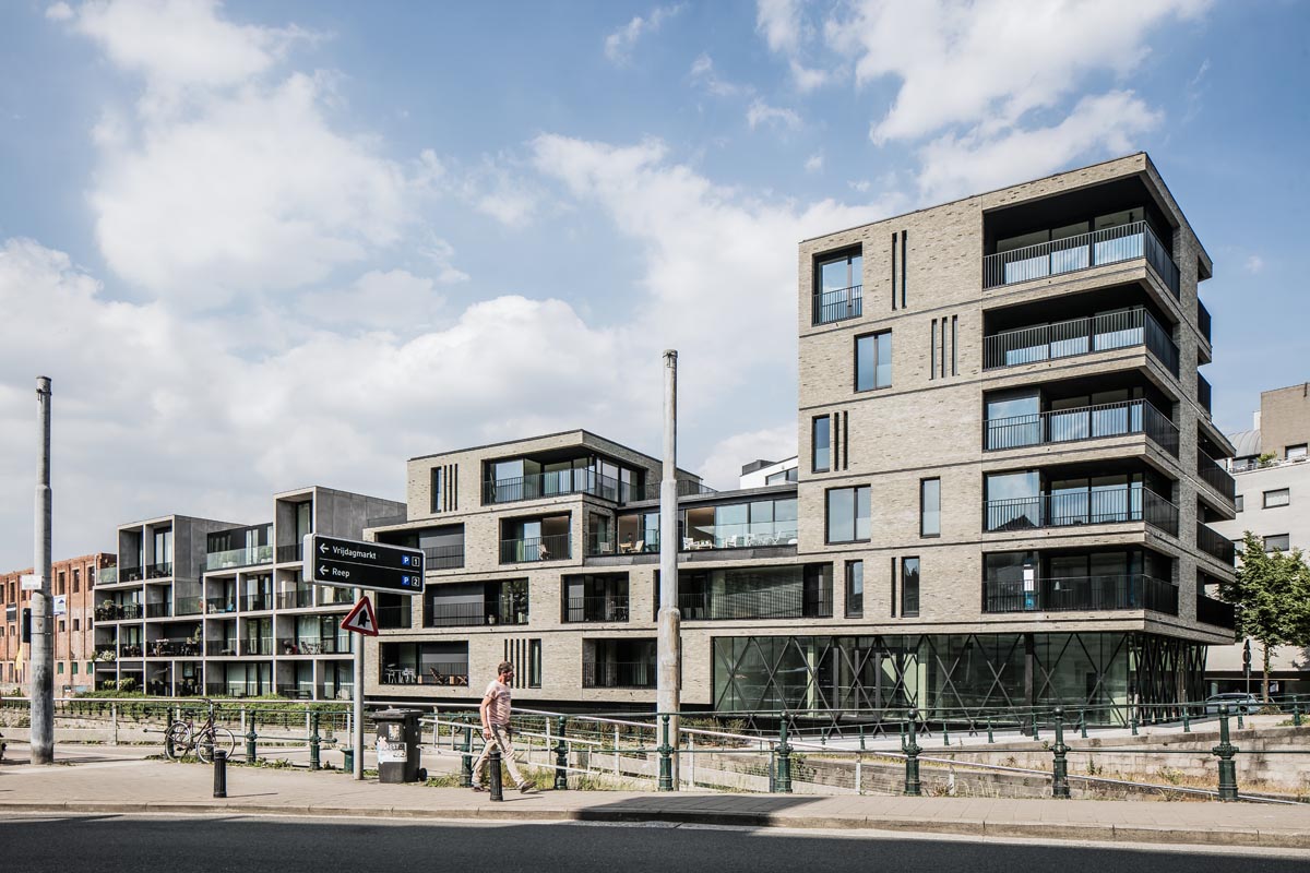 Hand-Made miniature green grey facing brick makes the building stand out thanks to its texture and colour 