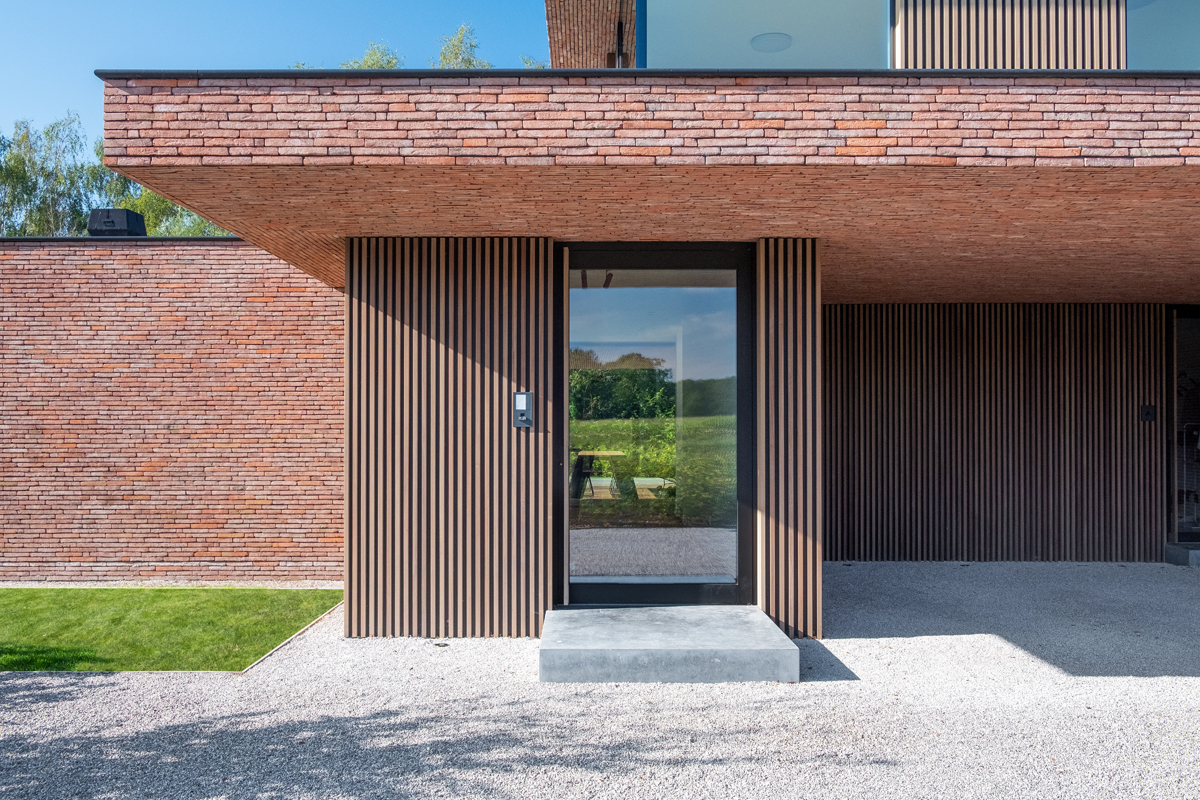 Brown-red Linea 3011 helps realise sleek lines of this contemporary NZE home