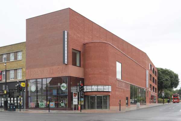 Award-winning bold architectural statement in urban setting with vibrant red facing brick