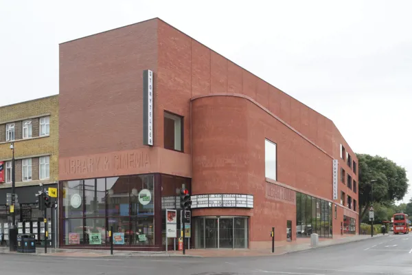 Award-winning bold architectural statement in urban setting with vibrant red facing brick