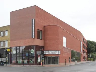 Award-winning bold architectural statement in urban setting with vibrant red facing brick