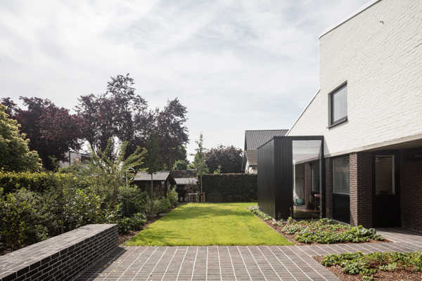 Choice of anthracite clay pavers enhances harmony between home and garden