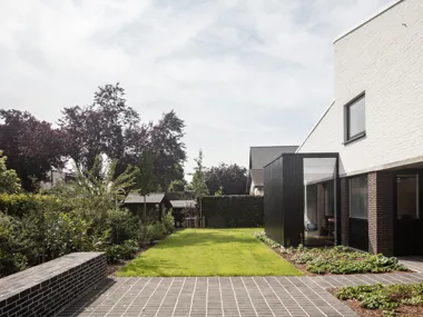 Choice of anthracite clay pavers enhances harmony between home and garden